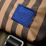 Blue patch with the Paul Smith signature logo on the front of the Paul Smith Multistripe Recycled Nylon Backpack with Signature Logo Patch.