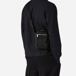 The Paul Smith Black Recycled Polyester Small Flight Bag with Signature Stripe Zebra Logo by Paul Smith.