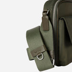 Close up of the Paul Smith Green Recycled Nylon Small Flight Bag with Signature Stripe Trims.