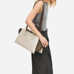 The wide, detachable, and adjustable shoulder strap on the Radley The Romilly Salt Leather Large Ziptop Multiway Bag.