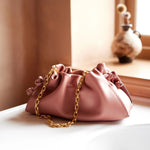 The soft and supple Radley The Roxburgh Carnation Leather Small Chain Clutch Bag.