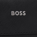 Close up of the BOSS embossed logo on the front of the BOSS Zair NS Zip Black Cross Body Bag with White Logo.