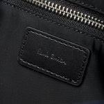 The Paul Smith signature embossed in silver foil inside the Paul Smith Multistripe Recycled Nylon Adjustable Tote Bag with Signature Logo Patch.