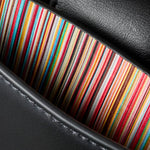 The Signature Stripe pattern lining of the Paul Smith Women's Black Leather Top Handle Bag with 'Signature Stripe' Trims.