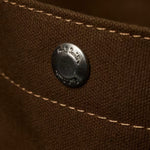 The press-stud closure on the Paul Smith Khaki 'Floral Street' Organic Cotton Blend Canvas Musette Bag.