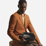 The Meisterstück Smooth Black Leather Wash Bag with Strap and Nib-Shaped Detailing by Montblanc.