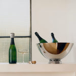 Styled shot of Bernadotte Champagne Stopper from Georg Jensen.