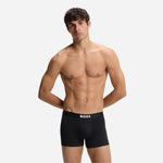Model wearing ONE 3-Pack of Black Cotton Stretch Boxer Briefs from BOSS.