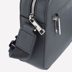 The BOSS brand name can be found on both the zips and the front leather of this cross body bag.