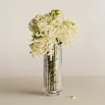 Georg Jensen Bernadotte Round Glass Vase with a white floral bouquet