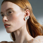 Model wearing Georg Jensen White Enamel Single Daisy Large Ear Cuff - Left Ear