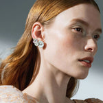 Model wearing Georg Jensen White Enamel Single Daisy Large Ear Cuff - Right Ear