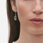 Model wearing Sterling Silver Offspring Earrings from Georg Jensen.