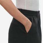 Model wearing Sterling Silver and 18 KT. Rose Gold Offspring Interlocking Bracelet from Georg Jensen.