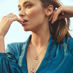 Model wearing Sterling Silver Mercy Large Pendant from Georg Jensen.