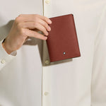 Model Shot of Red Oak Sartorial Leather Passport Holder by Montblanc.
