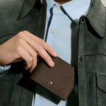 Lifestyle shot of 6cc Sartorial Leather Wallet in Ebony from Montblanc.
