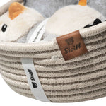 Close up of Lio penguin with rattle and bib gift set from Steiff.