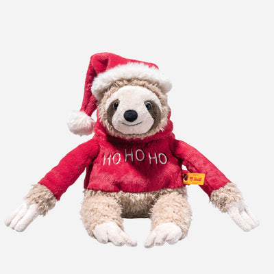 Sanny the Christmas Sloth wearing christmas jumper and santa hat from Steiff.