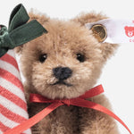 Close up of Ornament Teddy Bear with Candy Cane from Steiff.