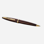Side View of Carene Amber Lacquer Ballpoint Pen with Gold Trim by Waterman.