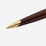 Close up of Carene Amber Lacquer Ballpoint Pen with Gold Trim by Waterman.