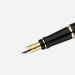 Close up of Expert Black Lacquer Fountain Pen with Gold Trim by Waterman.
