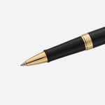 Close up of Hemisphere, Matt Black Rollerball Pen with Gold Trim by Waterman.