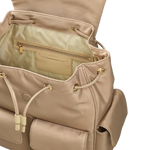 The main compartment of the Guildford Grove Medium Stone Flapover Backpack can be closed with both drawstrings and a magnetic flap, and has a zipped pocket inside.