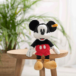 Steiff's Soft Cuddly Friends Disney Originals Mickey Mouse has embroidered eyes, stainless steel Button in Ear and synthetic stuffing.