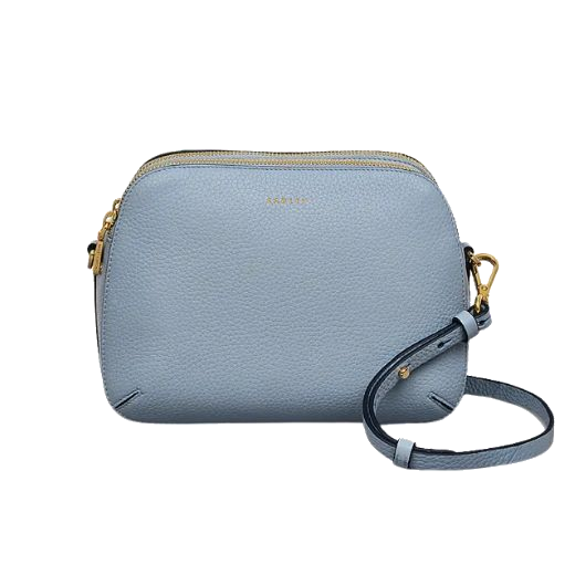 This Dukes Place Smoke Blue Grained Leather Cross Body Bag by Radley is made out of cowhide leather with a soft grain texture.