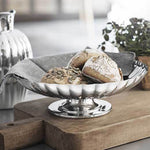 This Georg Jensen Stainless Steel Bernadotte Dish on Stand is perfect for holding food.