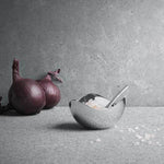 This Georg Jensen Stainless Steel Bloom Salt Cellar with Spoon is suitable for food.