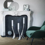 This Georg Jensen Stainless Steel Cobra Large Floor Candle is fine on its own or in a set.