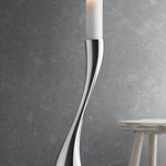 This Georg Jensen candle holder is made from polished stainless steel