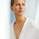 This Georg Jensen Sterling Silver Mercy Medium Pendant features a carabiner clasp closure.