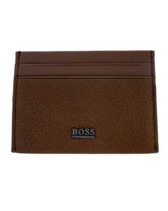 This Hugo Boss card holder is made from a brown leather material.