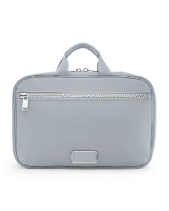 This TUMI Voyageur Halogen Blue Madeline Cosmetic Case has a front zip pocket and multiple compartments inside. 