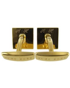 This pair of Hugo Boss gold cufflinks have been engraved with initials.