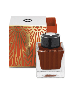 Montblanc's Meisterstück The Origin Collection Coral Ink Bottle, 50 ml has an art deco pattern on the packaging in gold and coral.