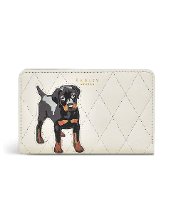 This Radley And Friends Chalk Leather Quilted Purse, Medium has a bifold interior in burnt orange leather.