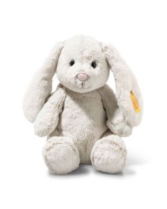 Steiff's Light at Night Hoppie Rabbit in Light Grey is made out of soft plush with a removable night light that has a timer function.