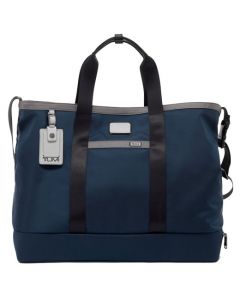 This Navy Alpha 3 Carryall Tote Bag was designed by TUMI. 