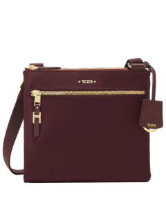 This Voyageur Purple Tula Cross Body Bag was designed by TUMI. 