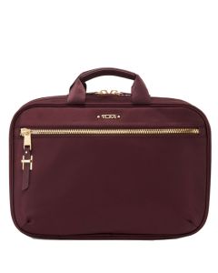 This Voyageur Purple Madina Cosmetic Case was designed by TUMI. 